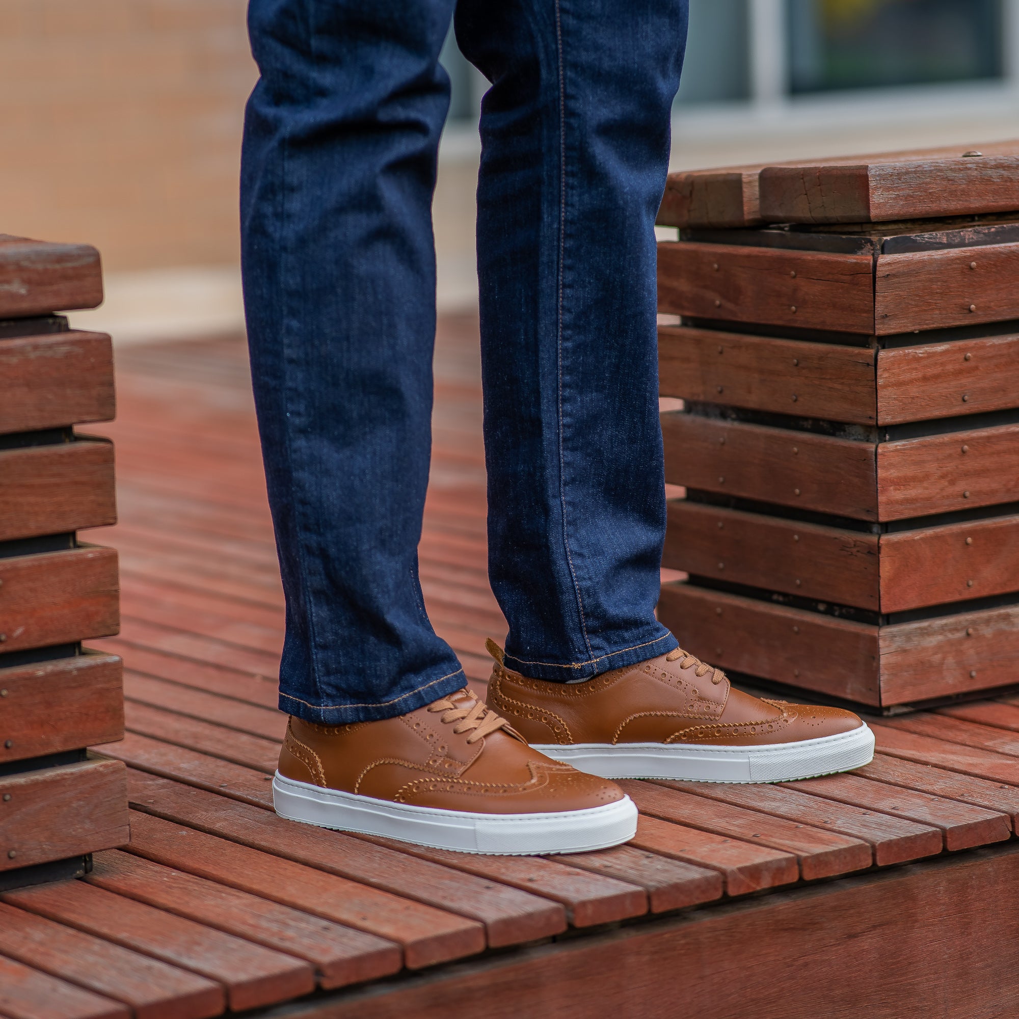 The Alpha brogue leather trainers for men in tan, paired with smart casual outfit for trendy look.