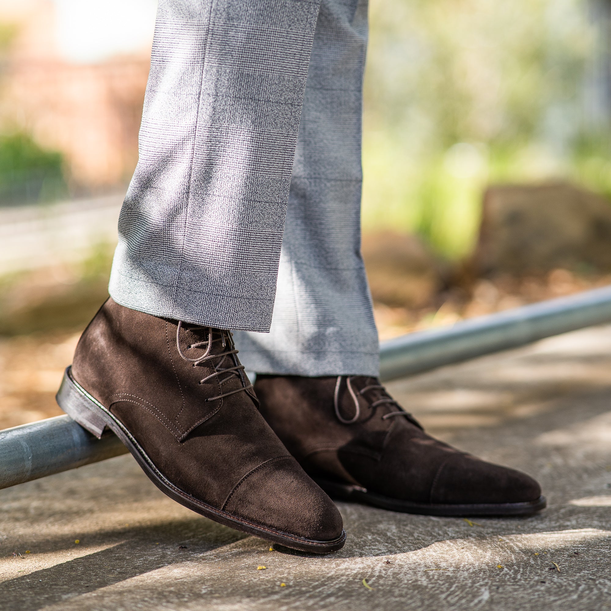 The Sahara espresso suede casual leather boot worn with 100% wool suit for business meeting