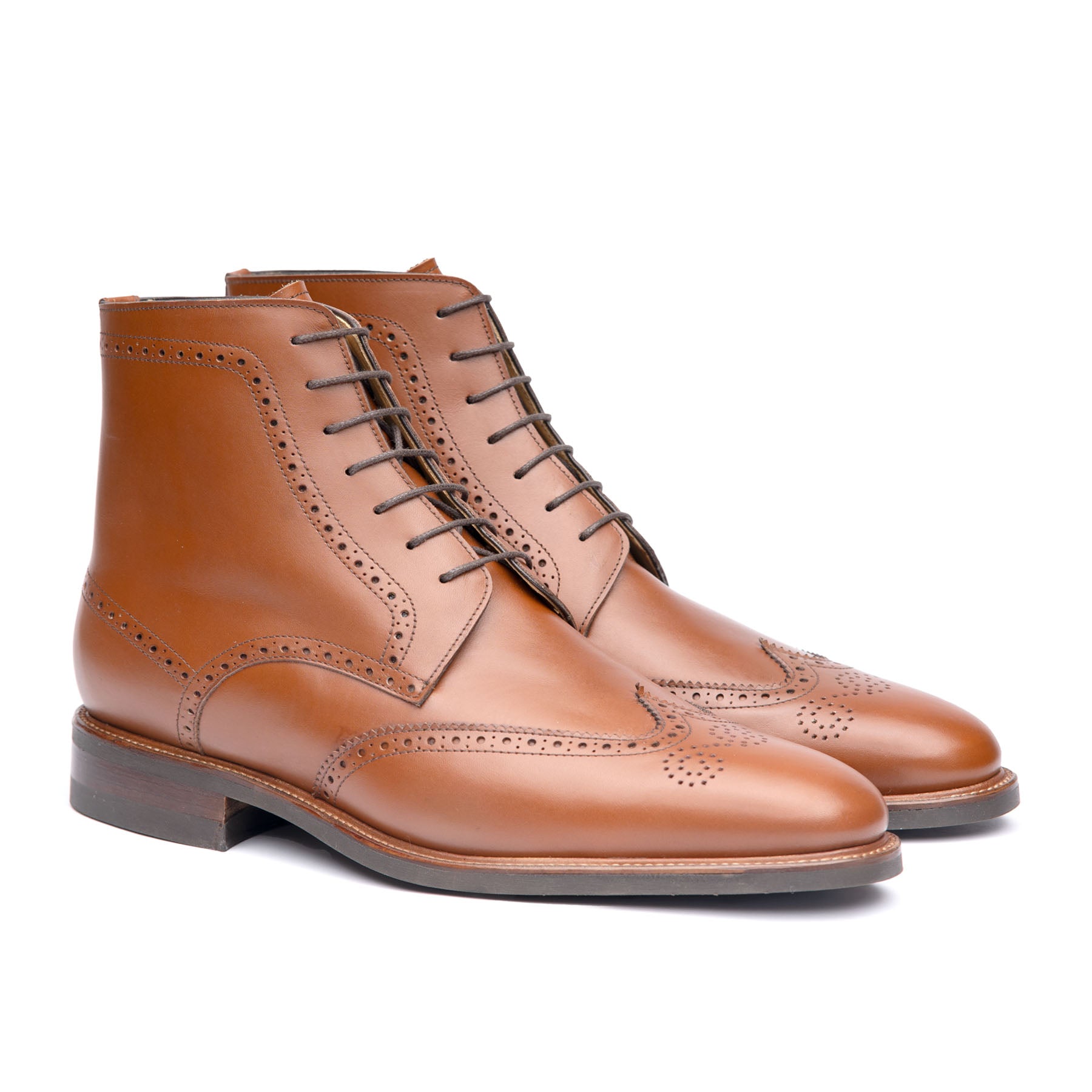 The Outback men’s full brogue lace up boot in tan, full grain calfskin leather, 360 leather welt and medallion at the toe cap 