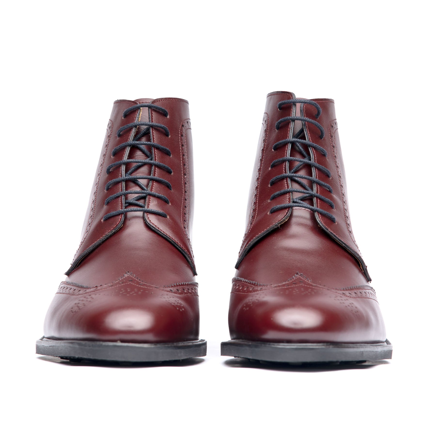 The Outback men’s wingtip leather boot in oxblood, almond with beautiful patina and lace up fastening.