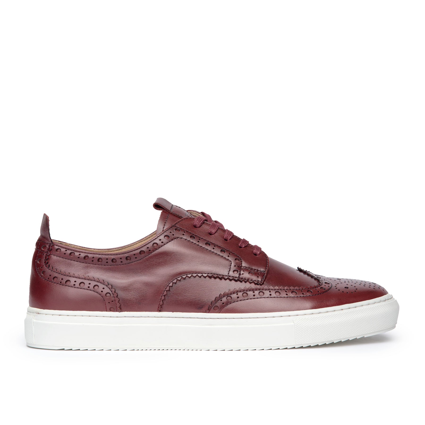 The Explorer men’s low top brogue sneakers in burgundy, made from box calfskin leather