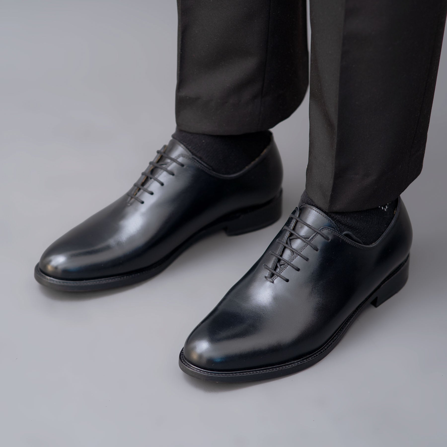 The Kingston black Oxford wholecut leather shoes, perfectly matched with ankle smart trousers and slim fit shirts