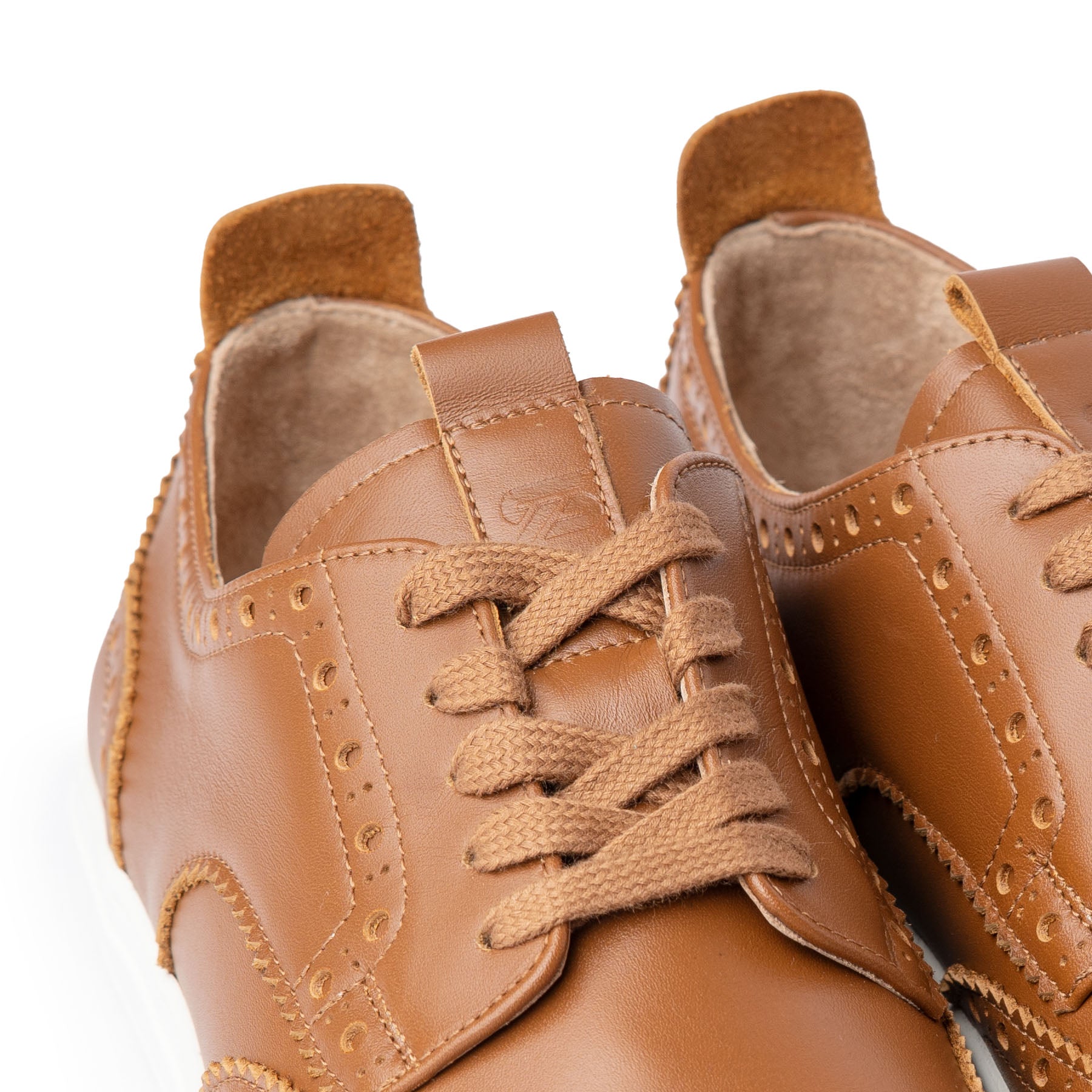 The Alpha wingtip sneakers in tan luxurious full grain calf leather upper and contrast detailing