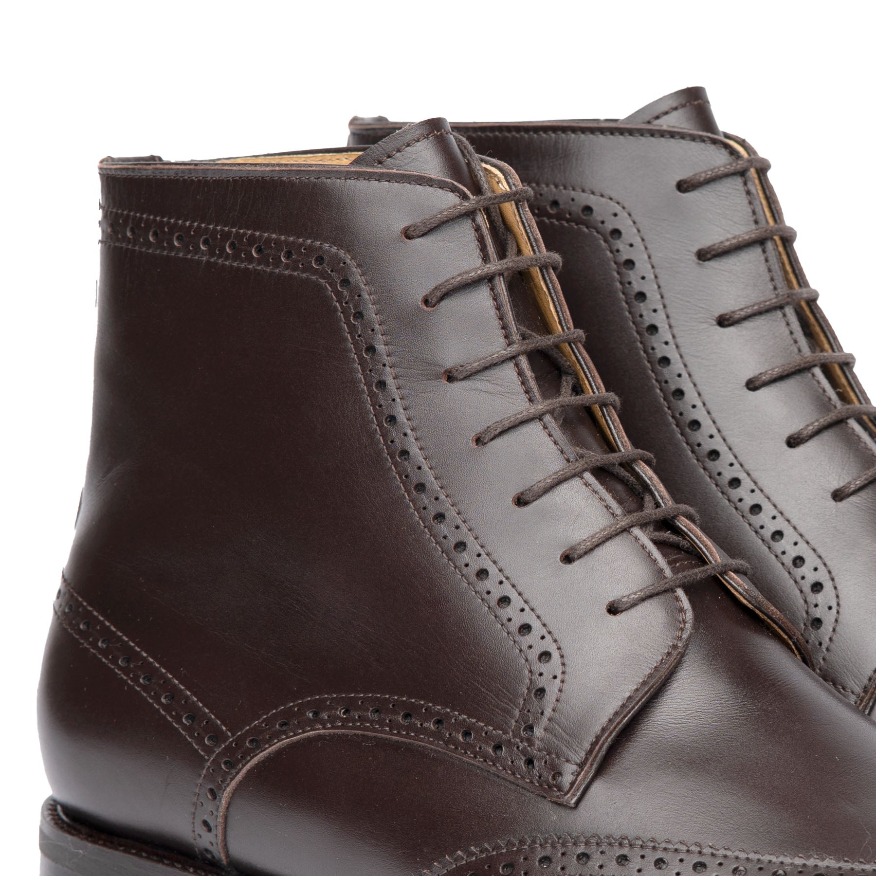 The Outback brogue lace up boot, made from box calfskin dark brown leather and handmade perforation on the upper leather.