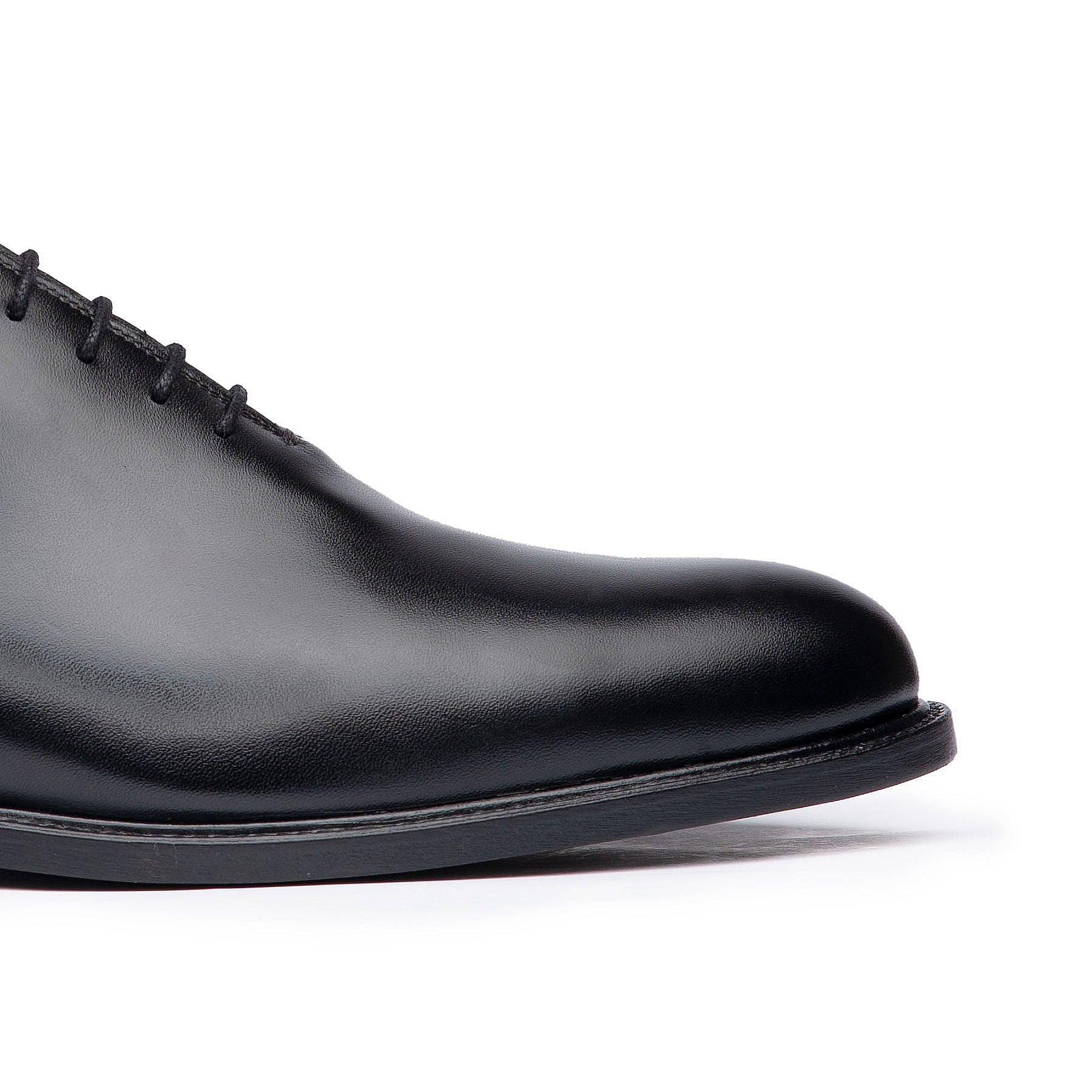 The Kingston oxford wholecut shoes in black with burnished box calfskin leather upper to age beautifully with time