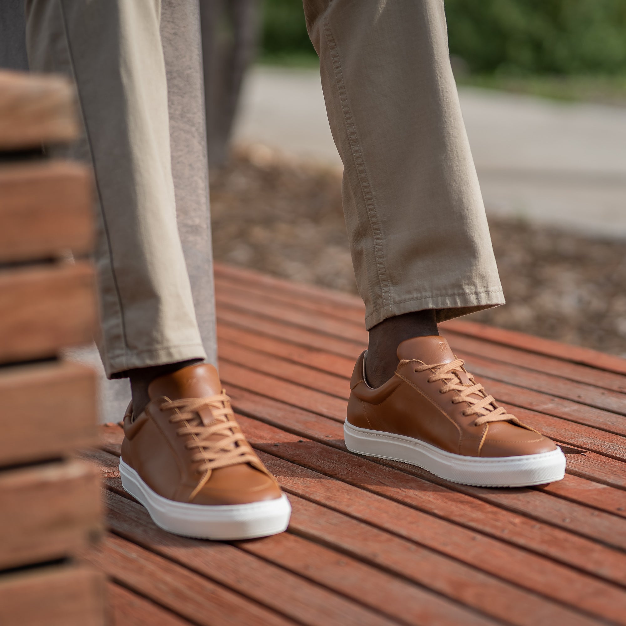 The Vin low top leather sneakers in tan, crafted with soft Italian leather, worn sockless with demin and casual sport coat 