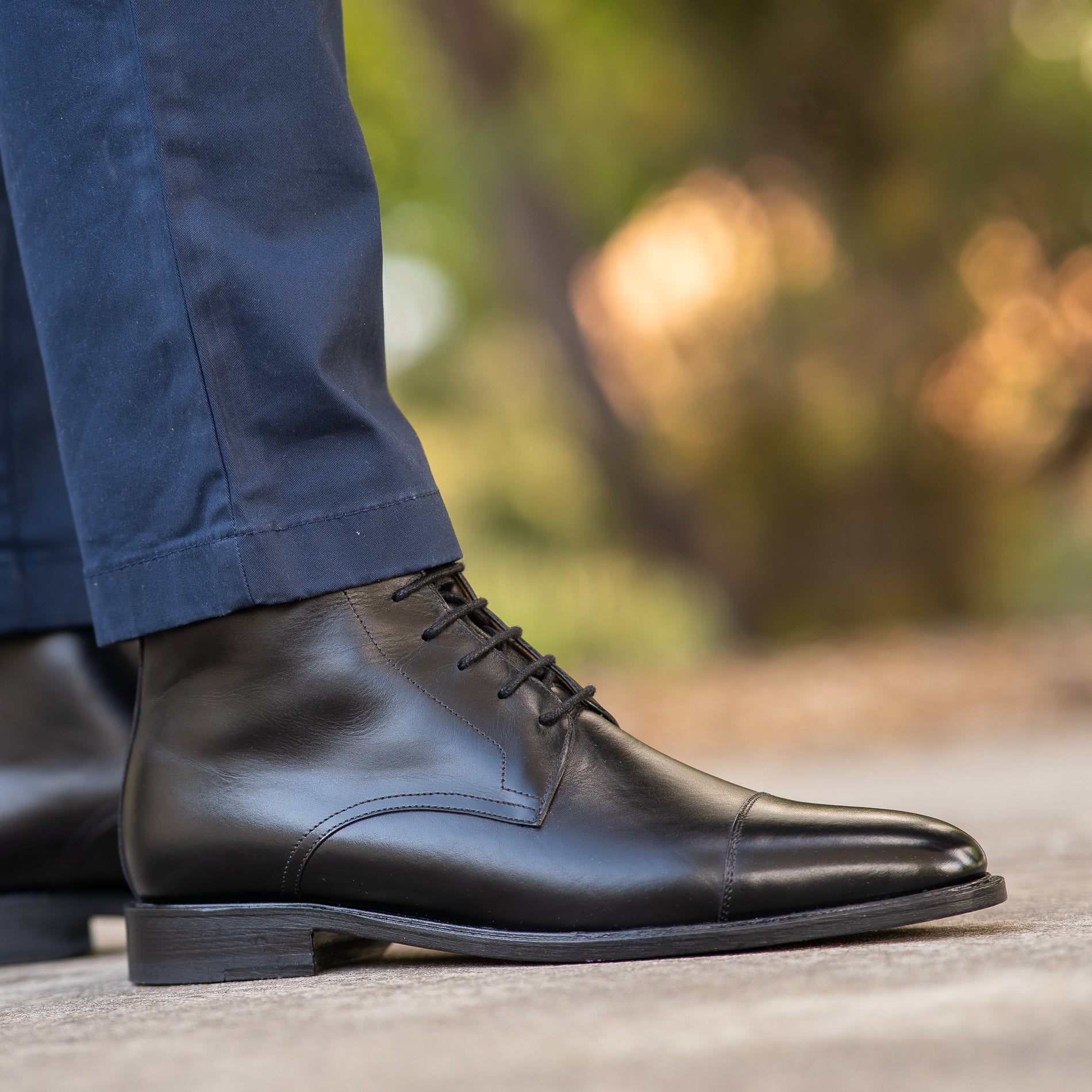 Black casual boots for men best styled with navy blue chinos polo shirt