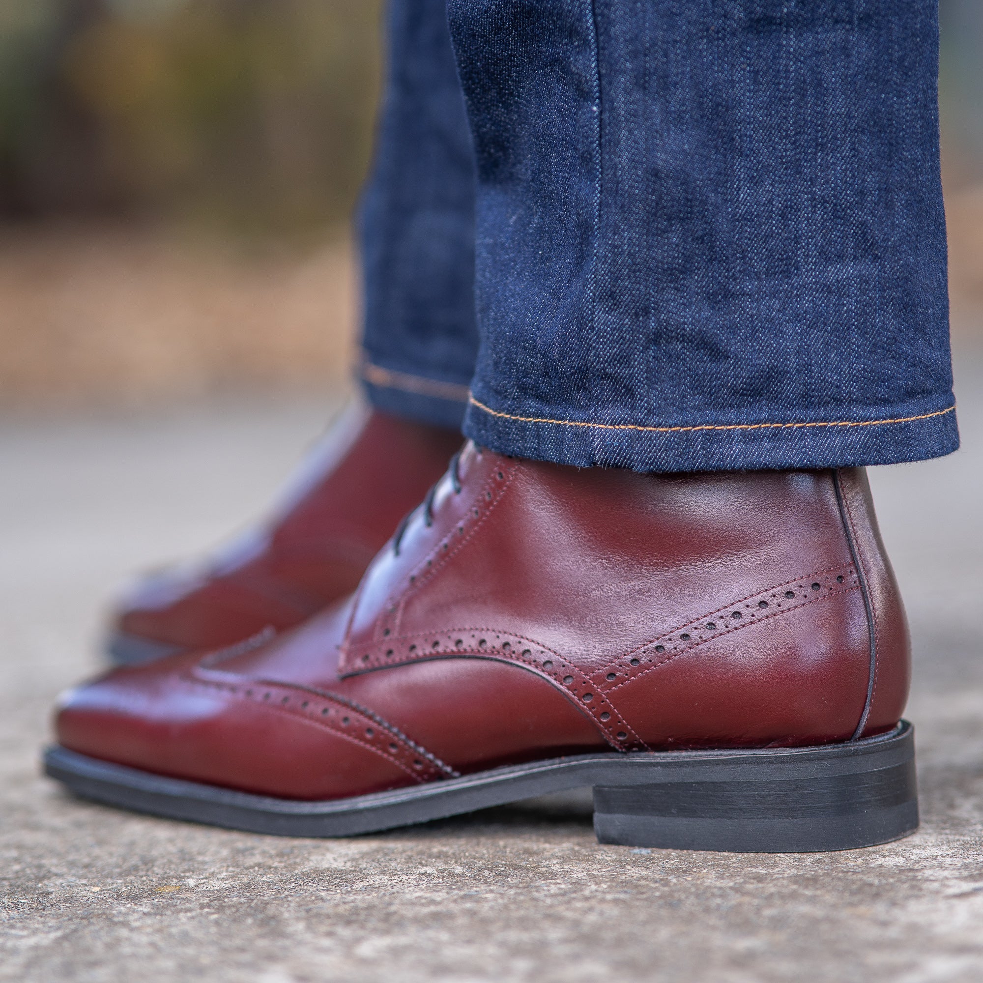 Blue smart ankle jeans and polo shirts paired with the mens maroon boots decorated with brogues