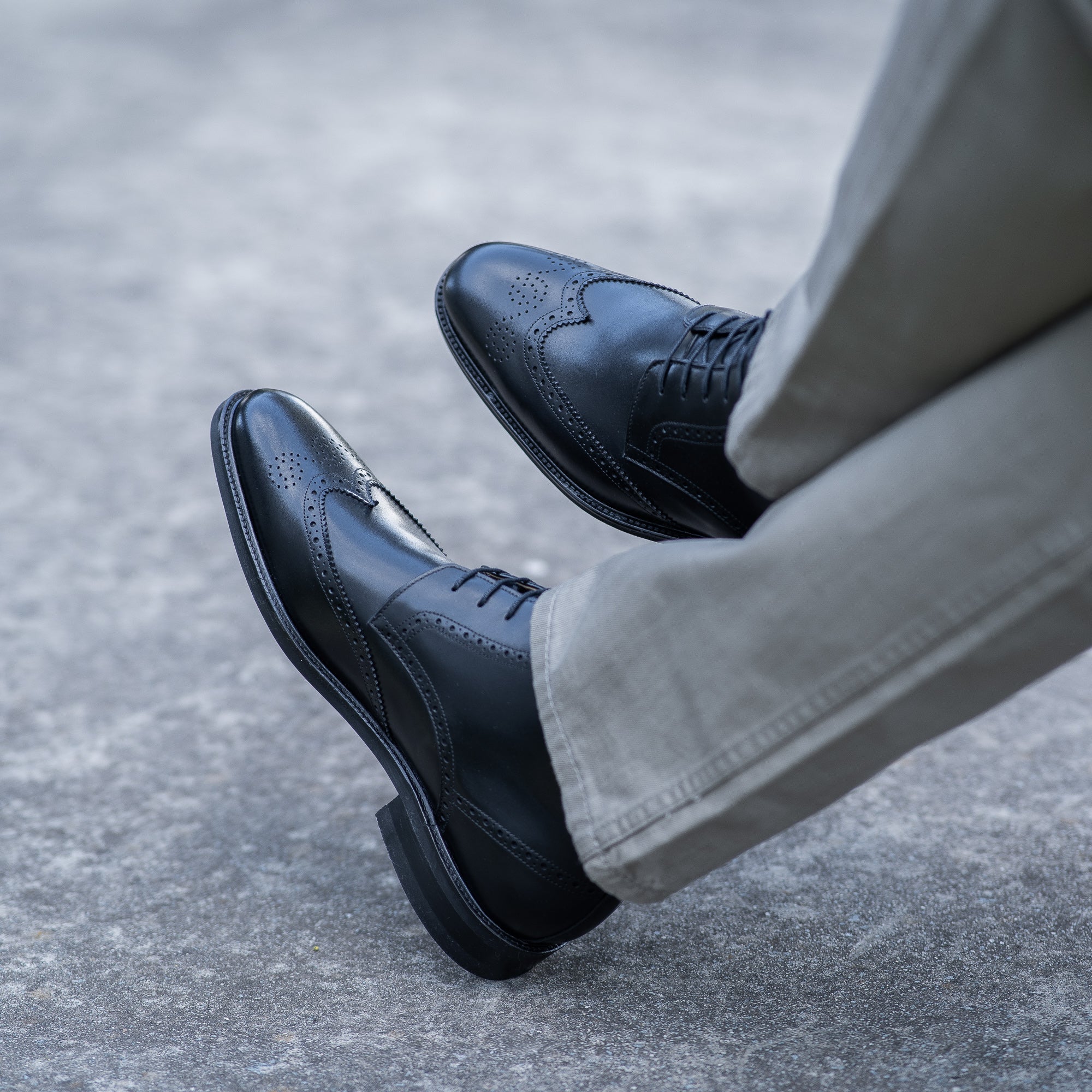 Mens boot brogues paired with beige chino and tailored jacket for casual styling 