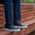 The Alpha brogue men leather trainers in black, worn with blue chinos and fine houndstooth