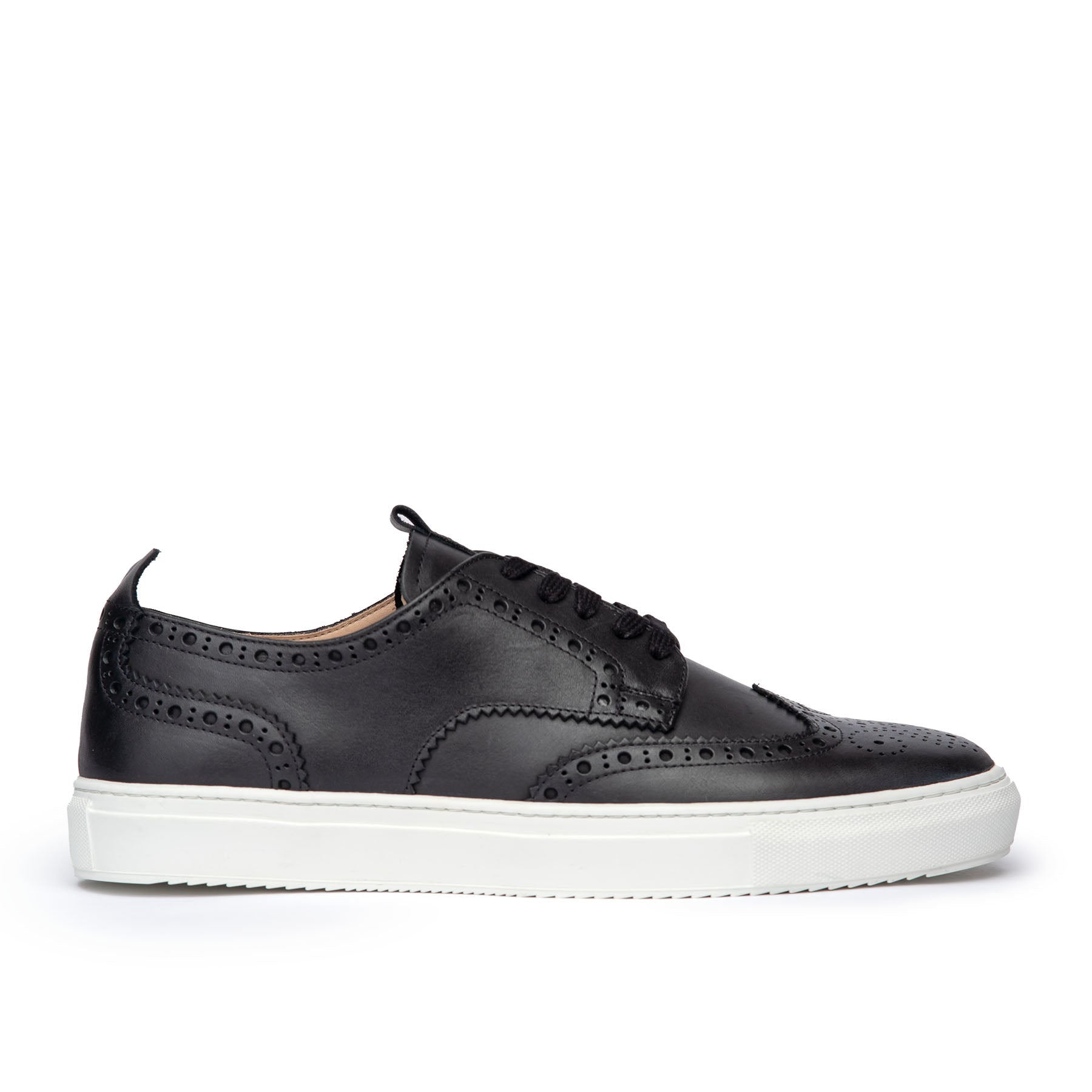 The Alpha men’s full brogue sneakers in black leather, decorated with perforation and medallion at the toe cap