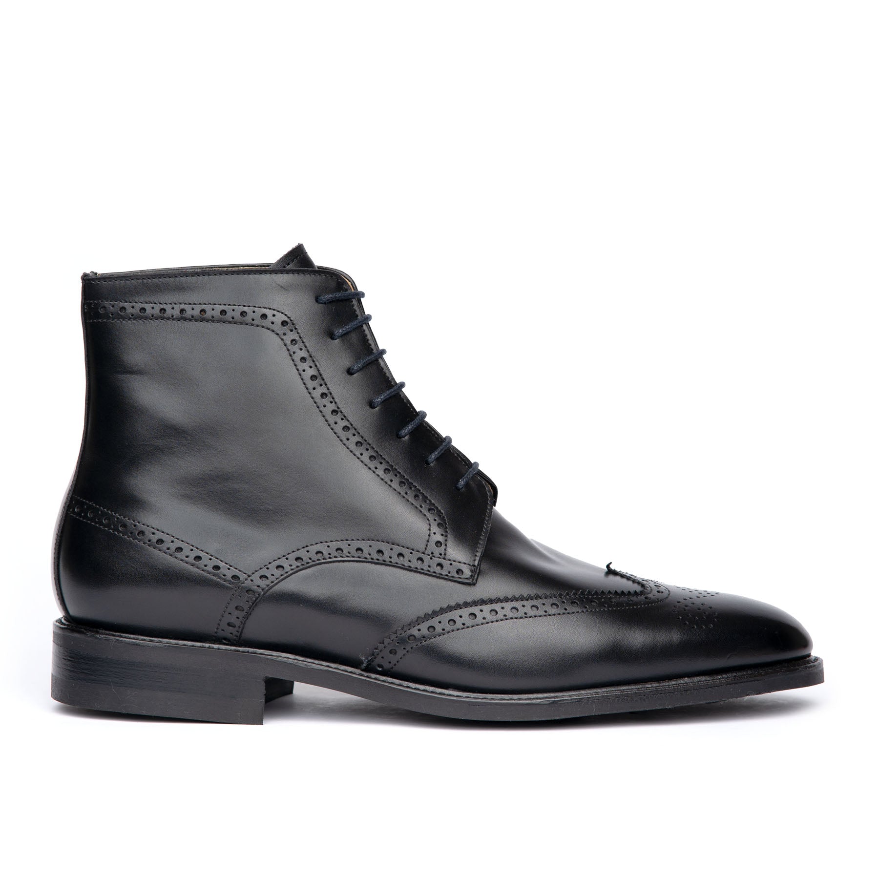 The Outback wingtip lace up boot in black calf leather, decorated brogues and leather welt to withstand any weather condition