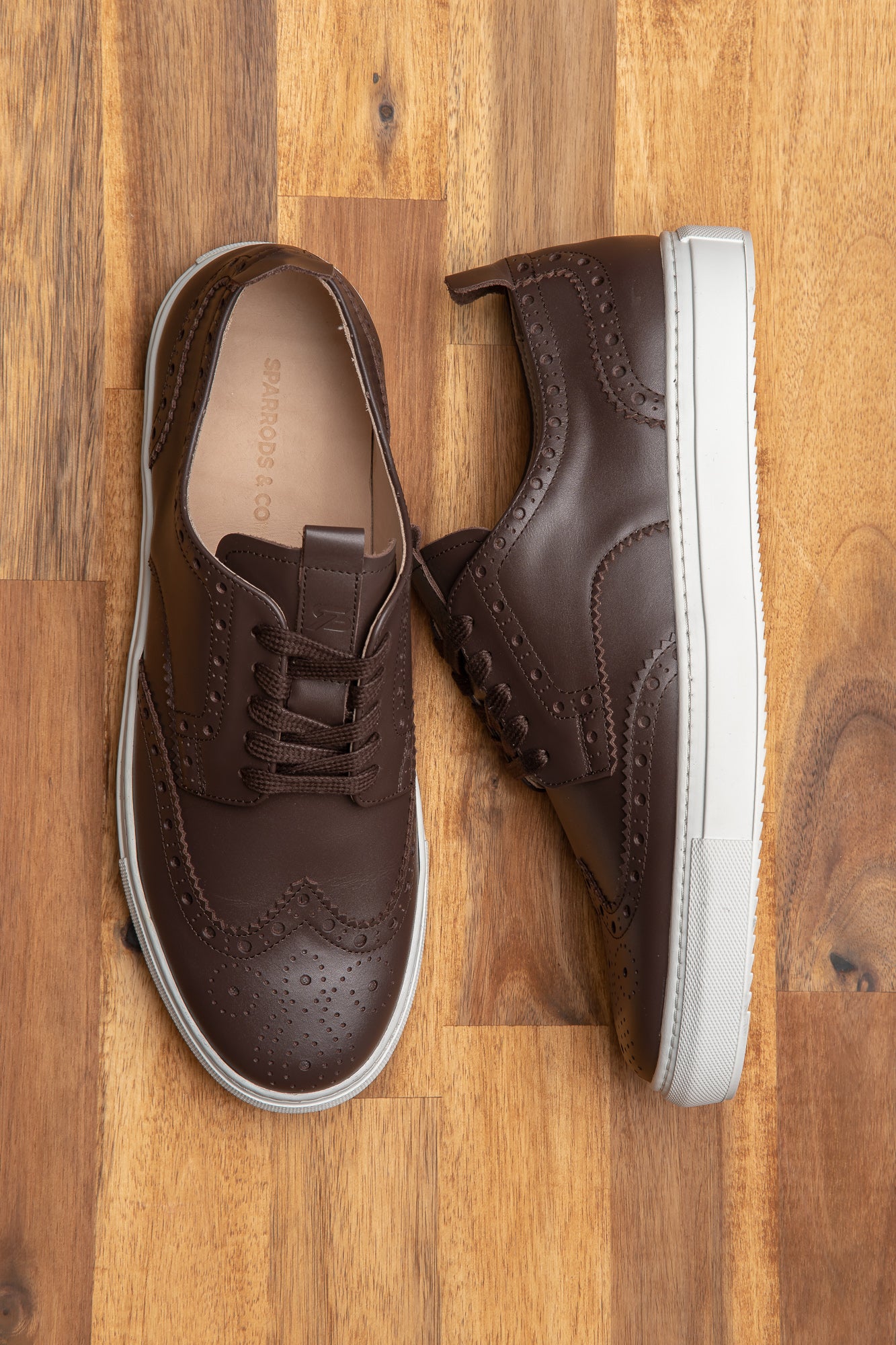 The Alpha brown brogues sneakers are made using finest leather materials for both men and women