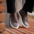 Brown casual sneakers immaculately styled with jeans and striped sport jacket