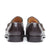 Dark brown monk strap shoes with stacked leather heels and offset buckles