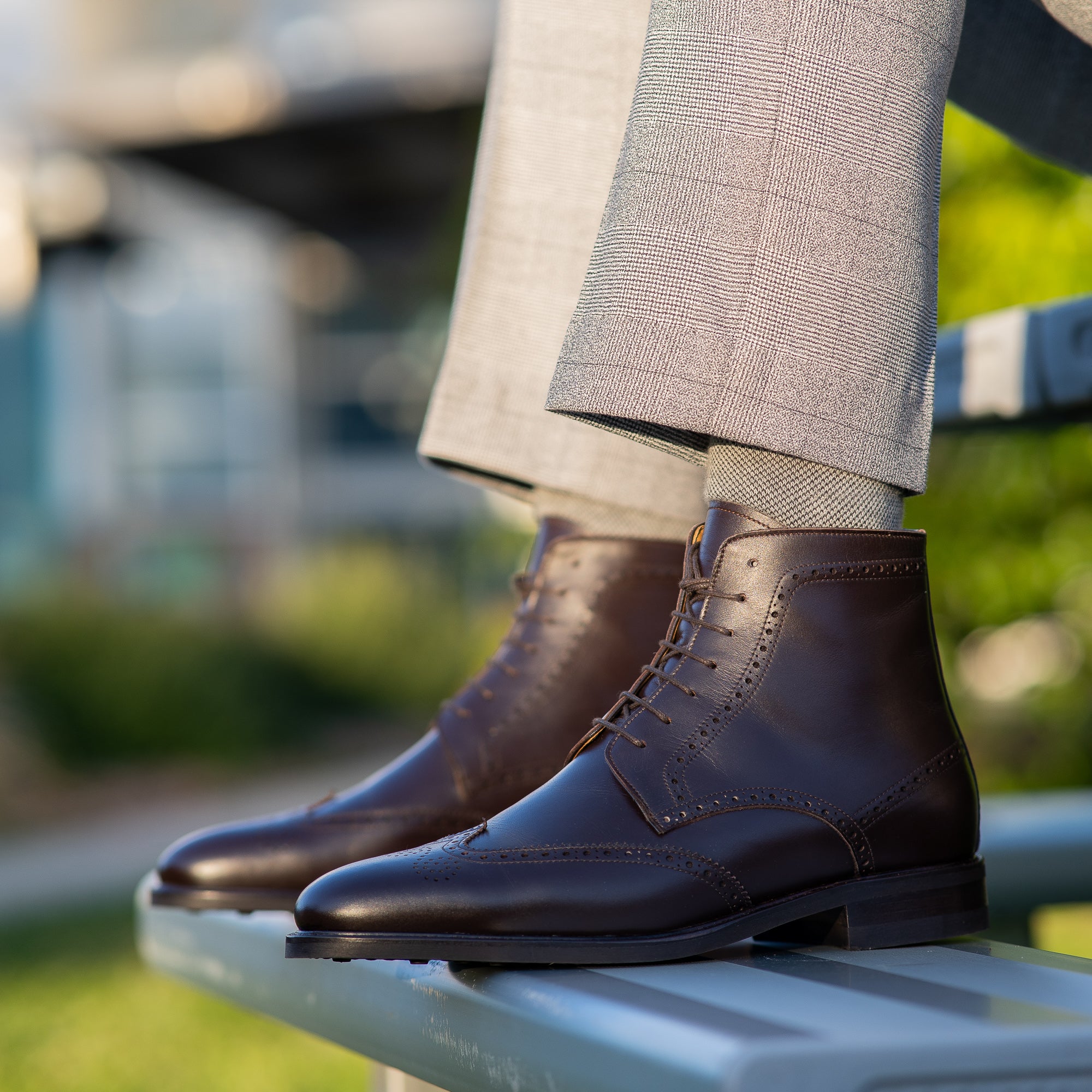 Brown leather brogue boots paired with blue grey tailored lined houndstooth blazer