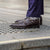 Brown buckle dress shoes paired nicely with business trousers and tailored wool jacket