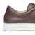 Brown dress sneakers featuring minimalist design and rubber sole