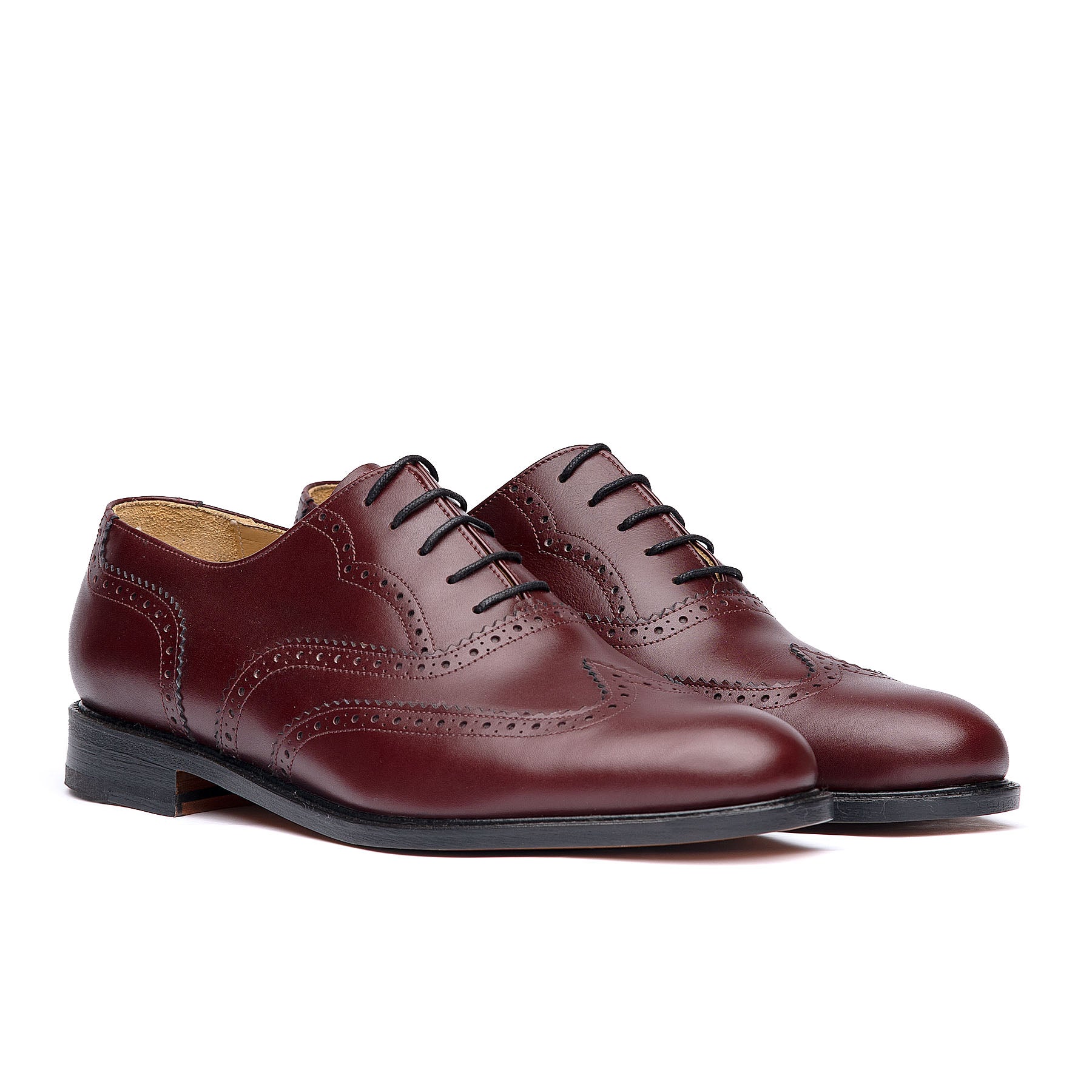 Burgundy wingtip shoes with leather sole and brogues for both casual and formal wear