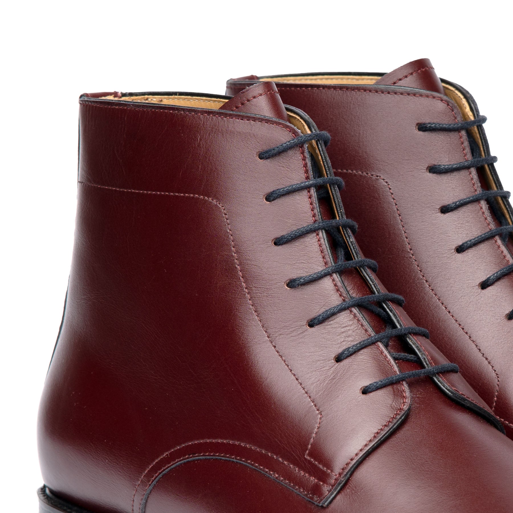 Burgundy lace up boots crafted from full grain calfskin leather and blind lace eyelets