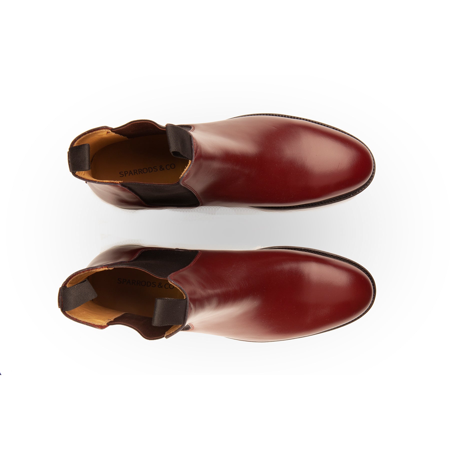 Mens burgundy chelsea boots crafted from single piece of full grain leather and elastic side panel