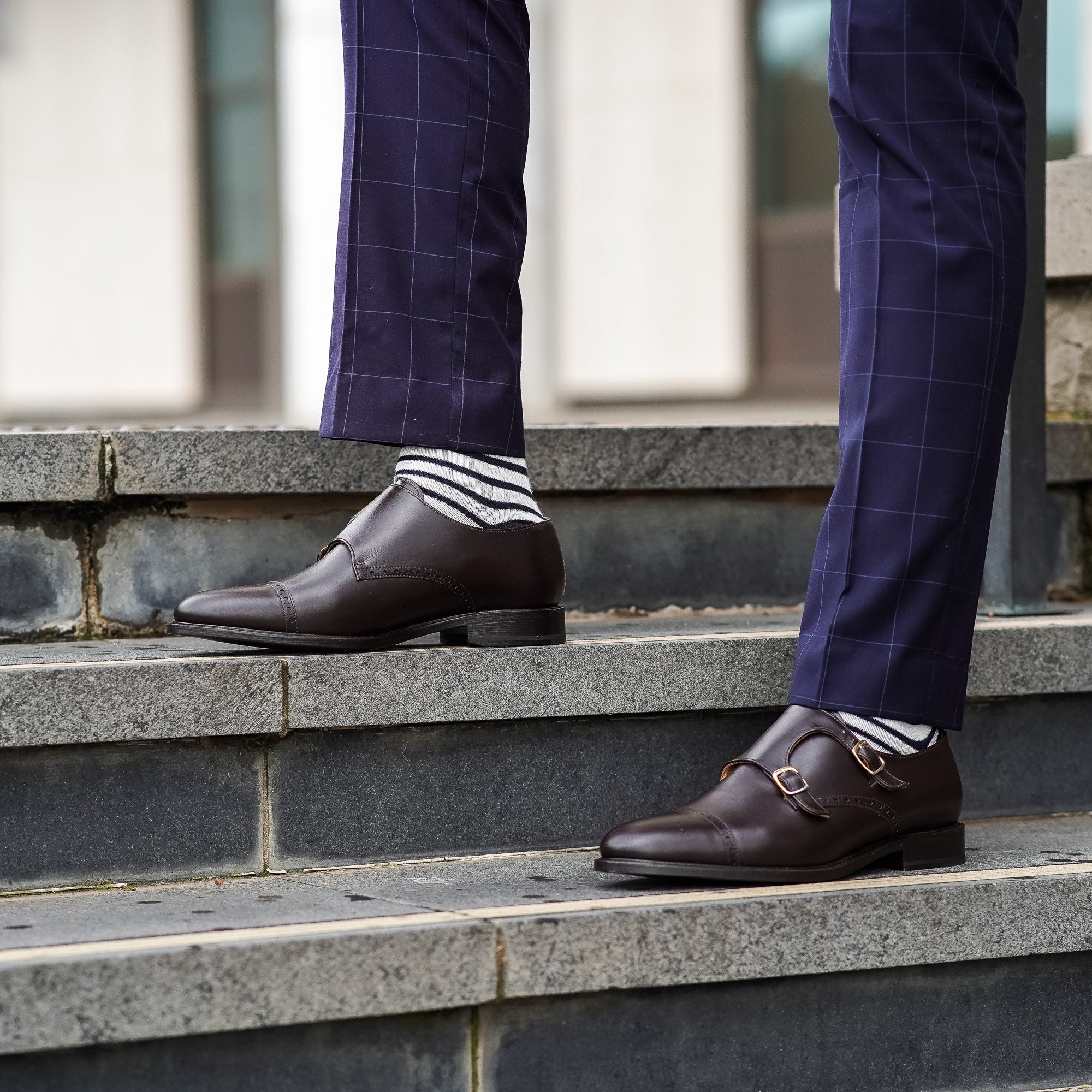 Mens brown monk strap dress shoes paired with business shirt, slim fit pants and cotton socks