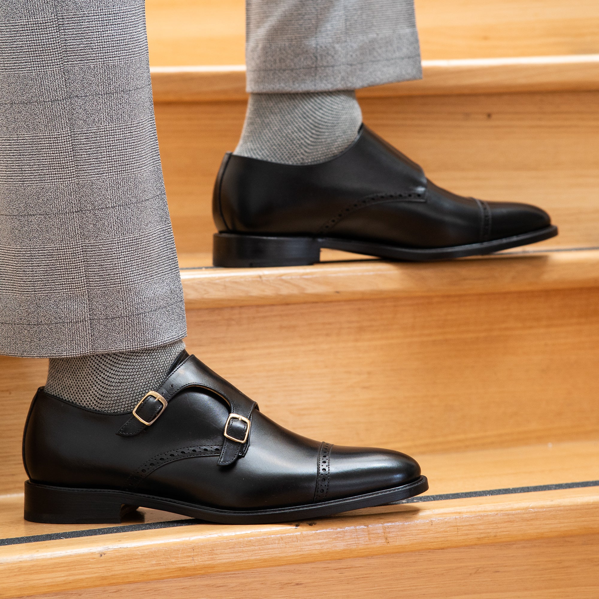 Tuxedo suit in grey paired with black double strap monk shoes