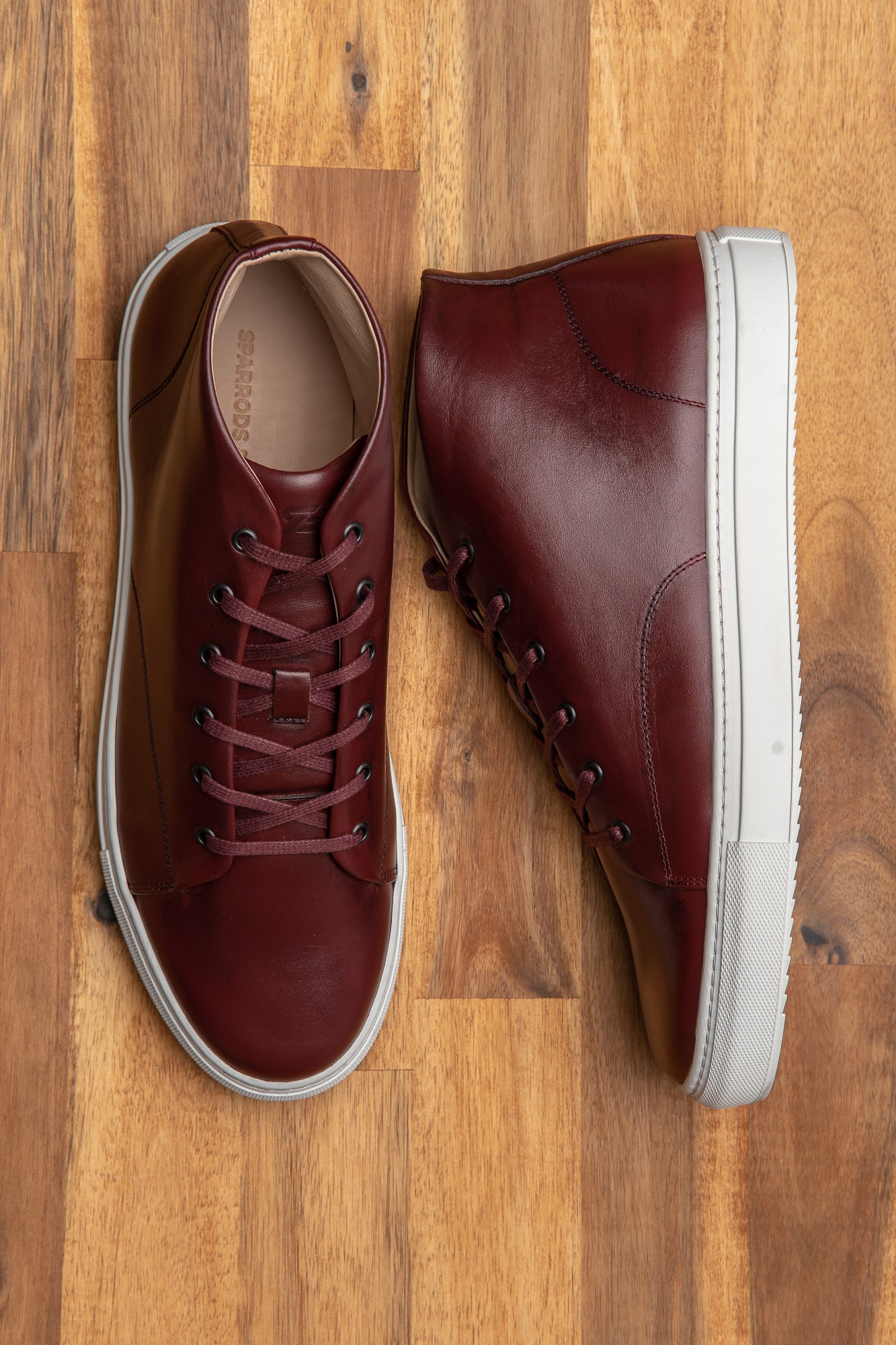 Shop high top sneakers for men featuring minimalist design and fully leather lined.