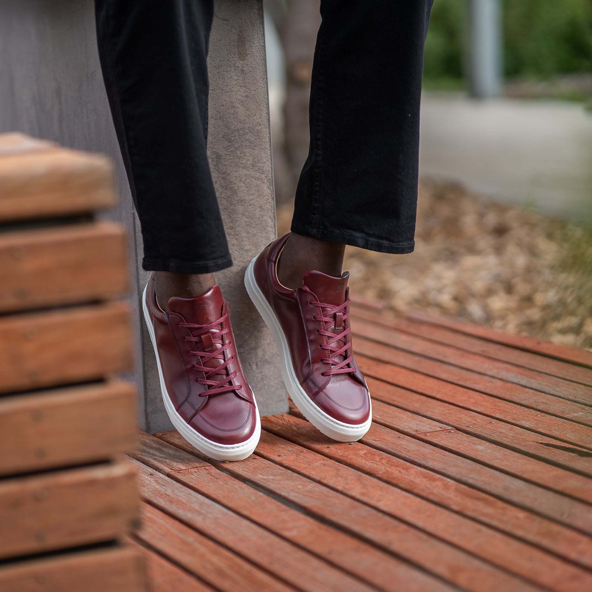 Men casual shoes sneakers featuring low top design and white rubber sole styled nicely with jeans