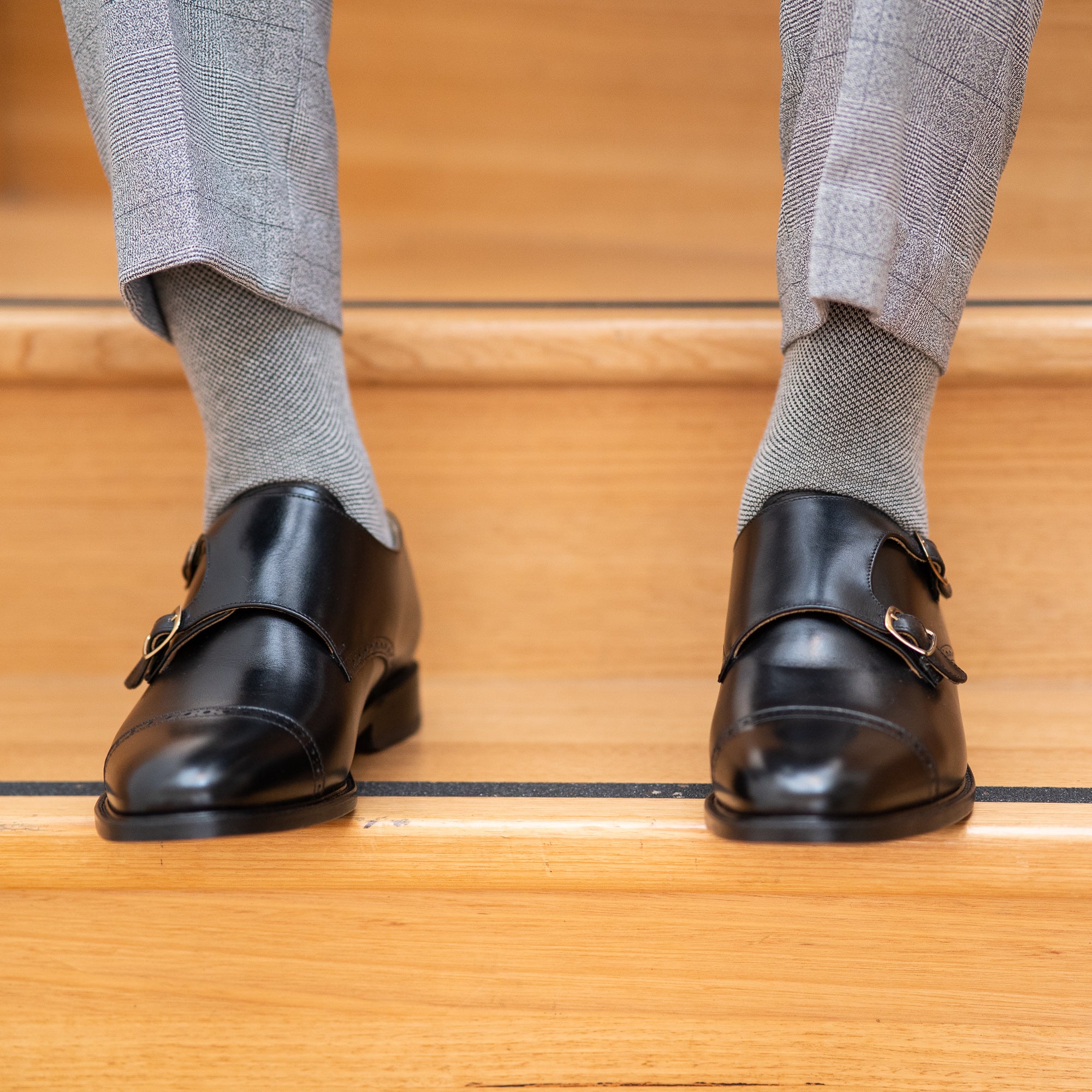 Mens black double monk strap shoes worn with luxurious slim fit merino wool dress pants