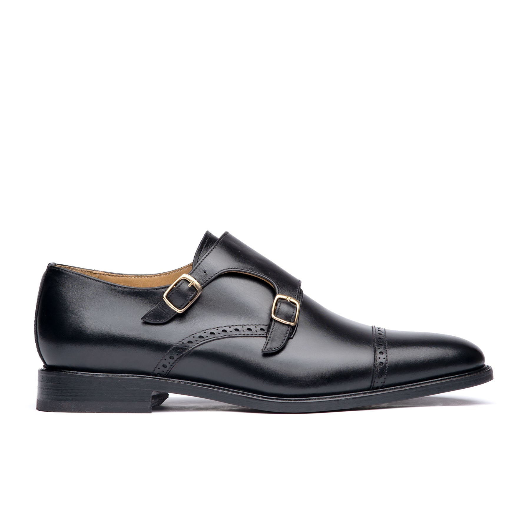 Black double monk strap shoes with quarter brogue detail across the toe cap and 360 leather welt