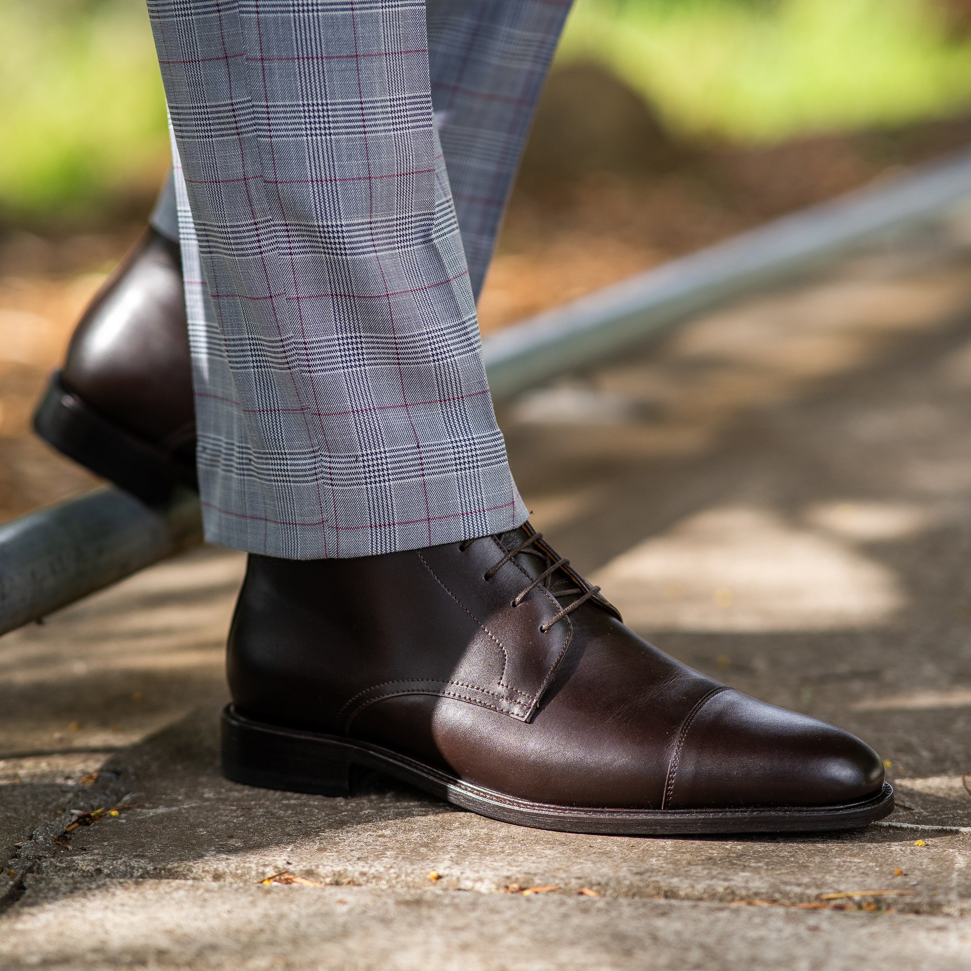 Mens brown leather lace up boots styled with striped wool suit and business shirt