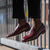 Burgundy penny loafer paired with 100% merino bespoke dress pant for professional look