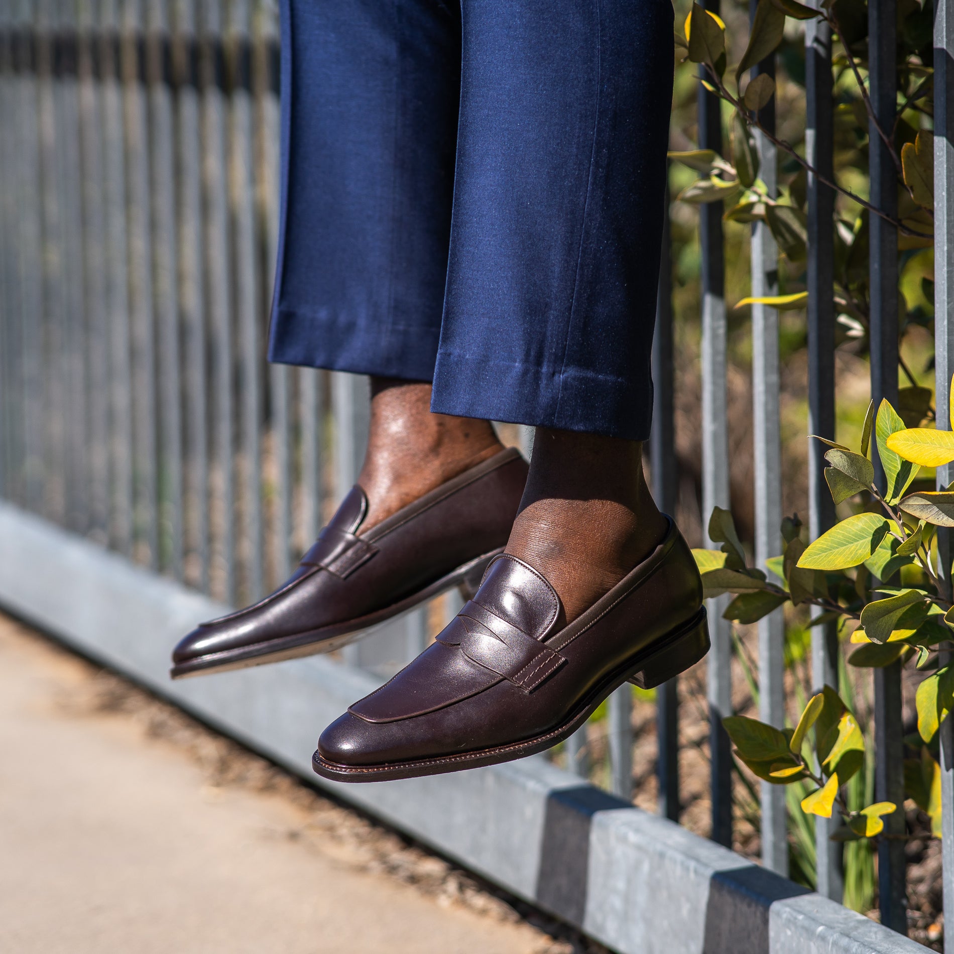 Brown leather loafers matched with houndstooth navy bespoke suit for formal setting