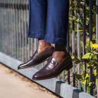 Brown leather loafers matched with houndstooth navy bespoke suit for formal setting