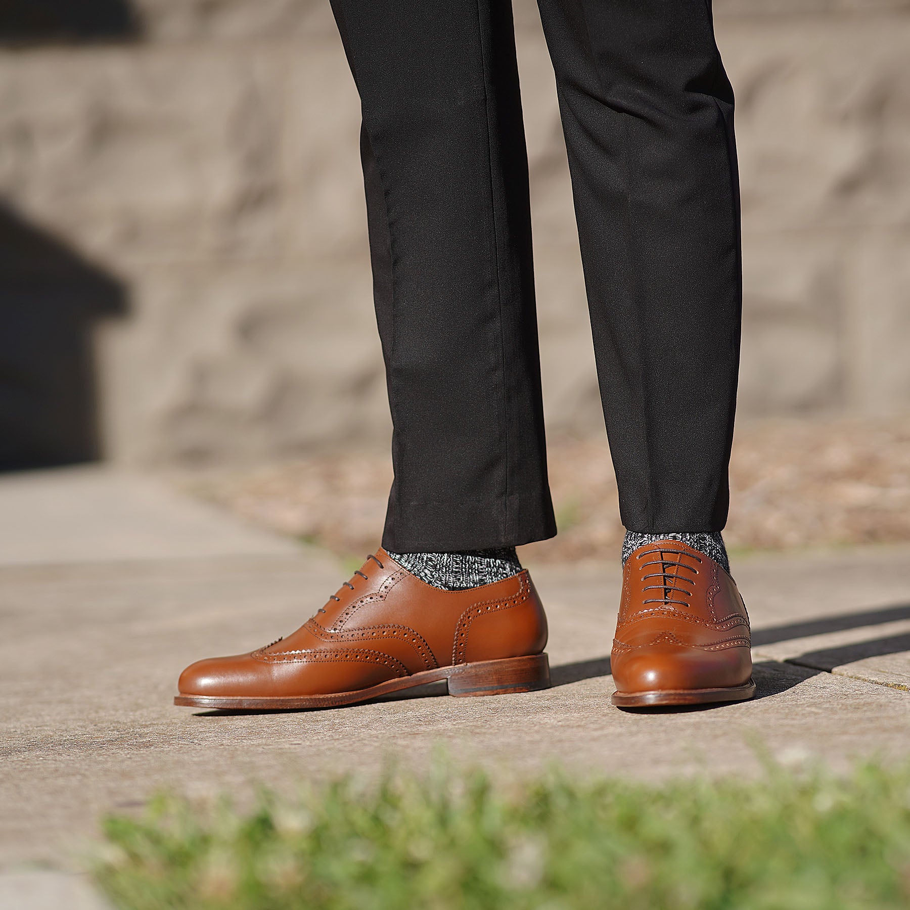 Mens brogues in tan leather, paired with bespoke dress pant and plain grey shirt