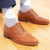 Mens tan brogues paired with mixed of navy blue and white cotton socks