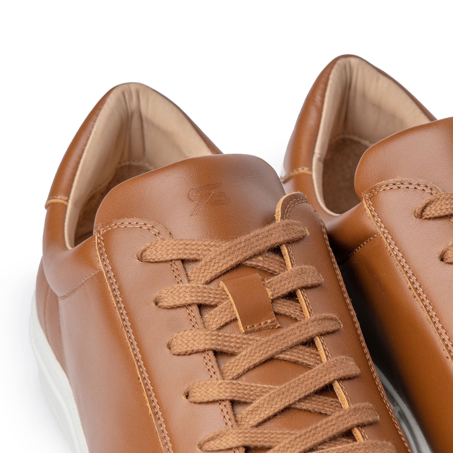 Minimalist travel shoes built using tan leather and rubber sole for everyday wear