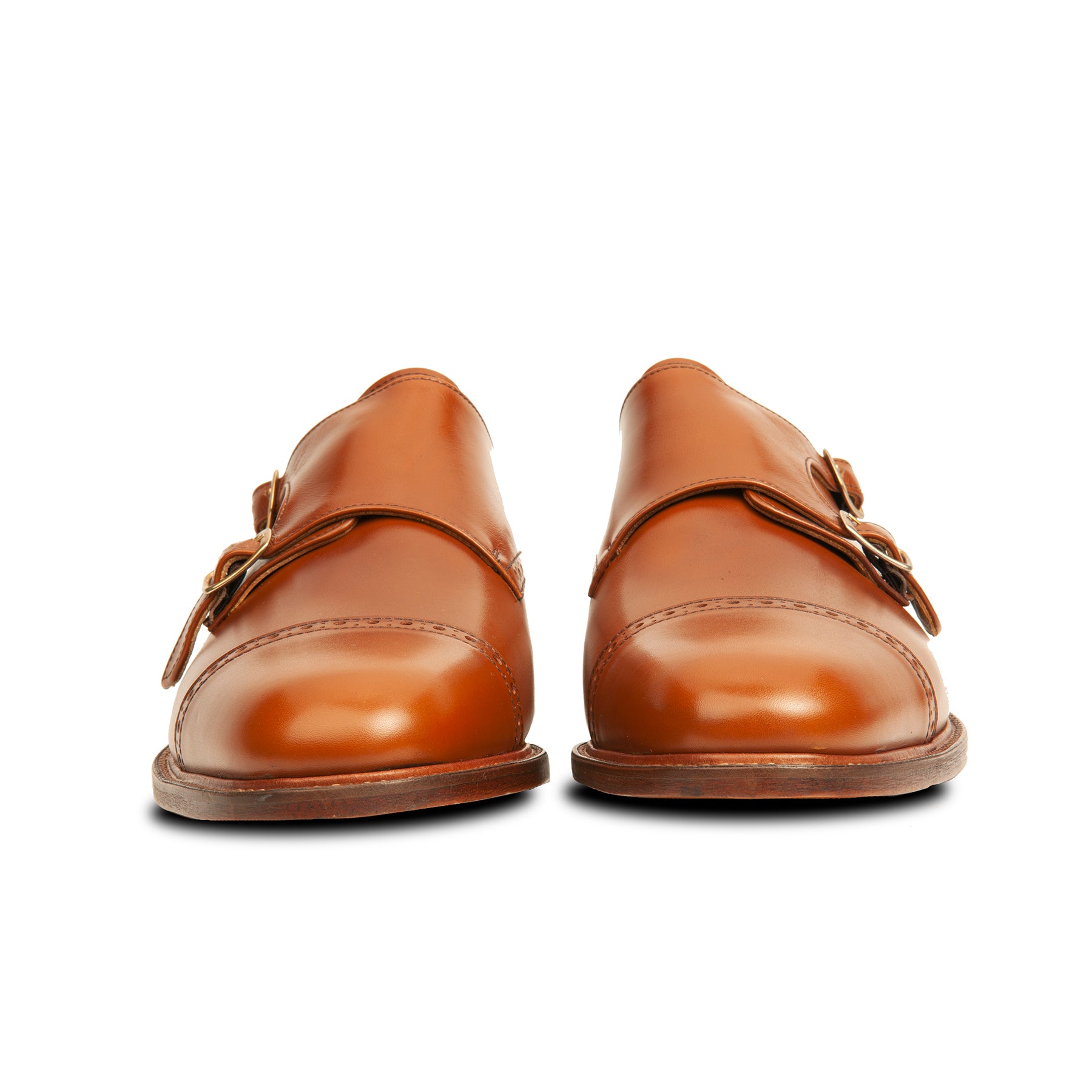 Men's monk strap shoes in tan with stacked leather heel and double buckles.