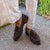 Brown suede tassel loafers paired with Italian bespoke blue suit for the office