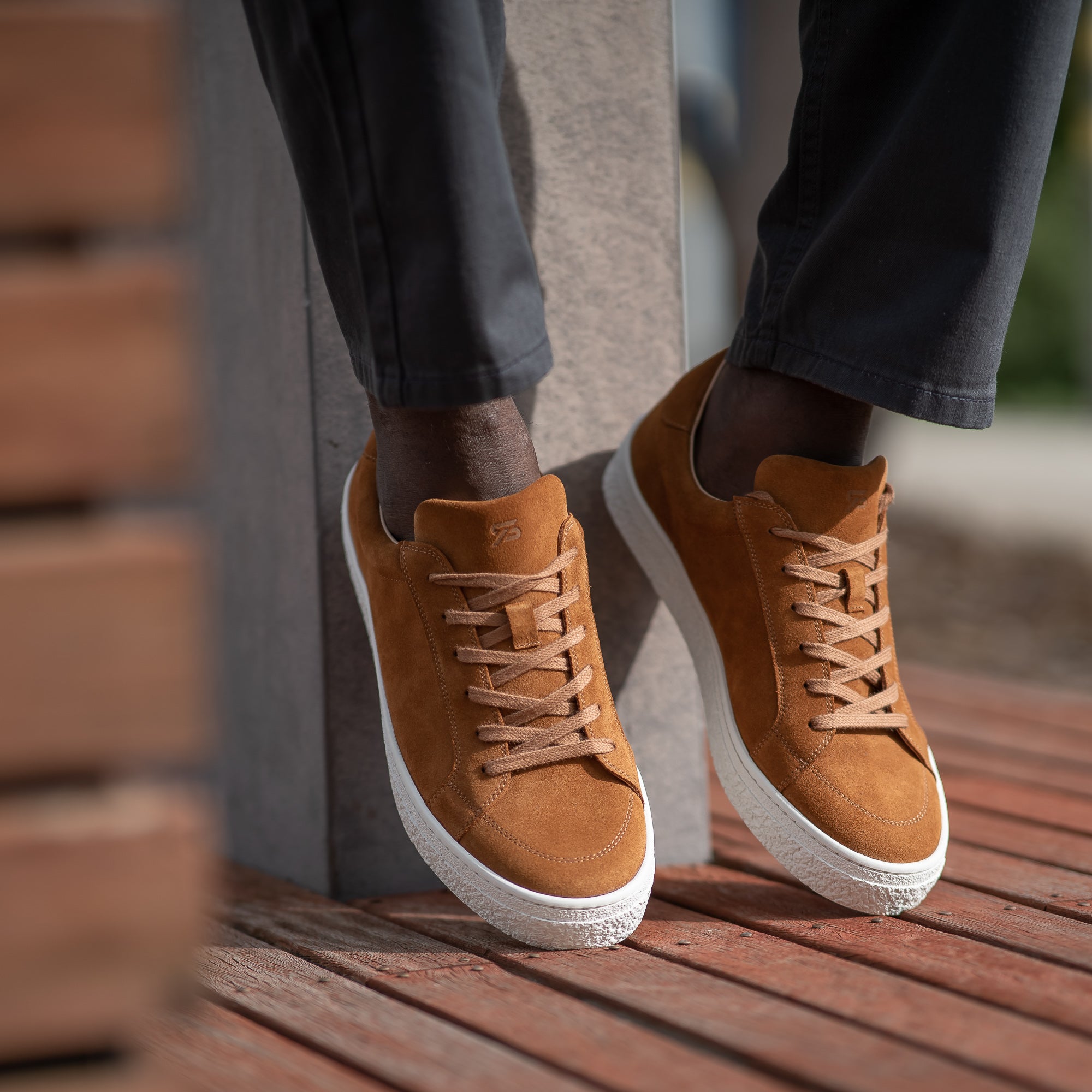 Suede sneakers mens perfectly styled green khaki and striped polo shirt.