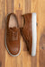 The low top wingtip sneakers, the Alpha in cognac, beautiful perforation, and medallion on the toe cap