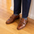 Men's dress shoes with buckle paired nicely with dress pant trousers and plain business shirt