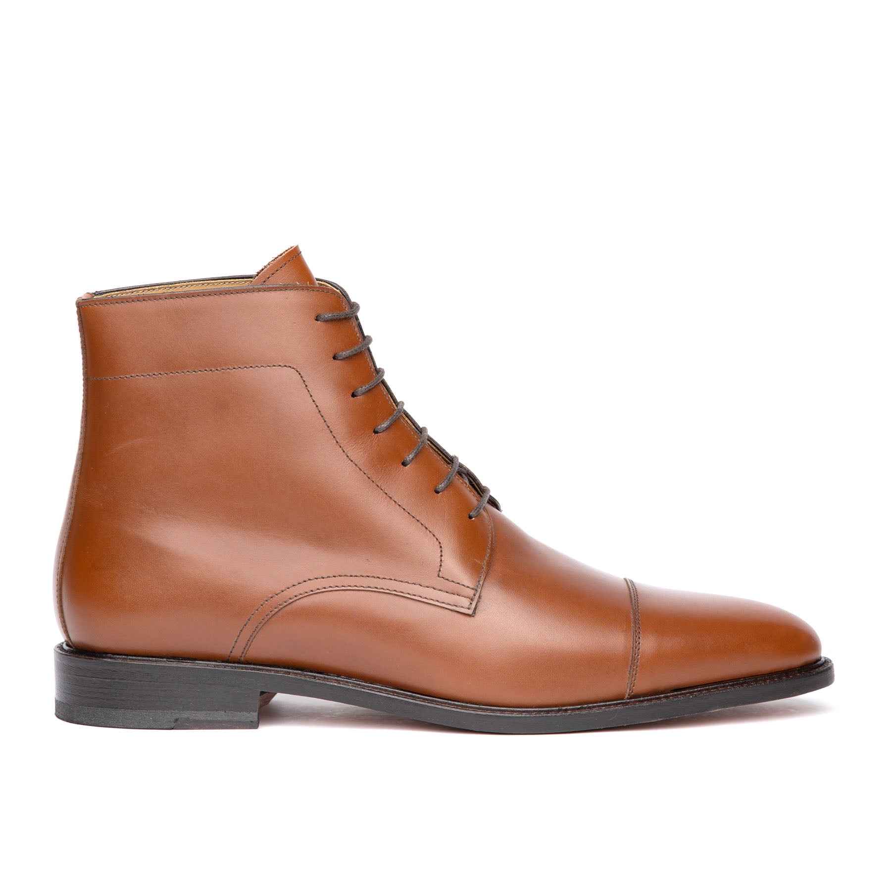 Tan lace up boots crafted using welted construction, leather welt and blind eyelet for everyday wear