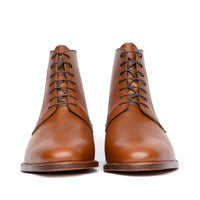 High quality mens tan leather boots featuring almond toe and beautiful patina at the toe cap 