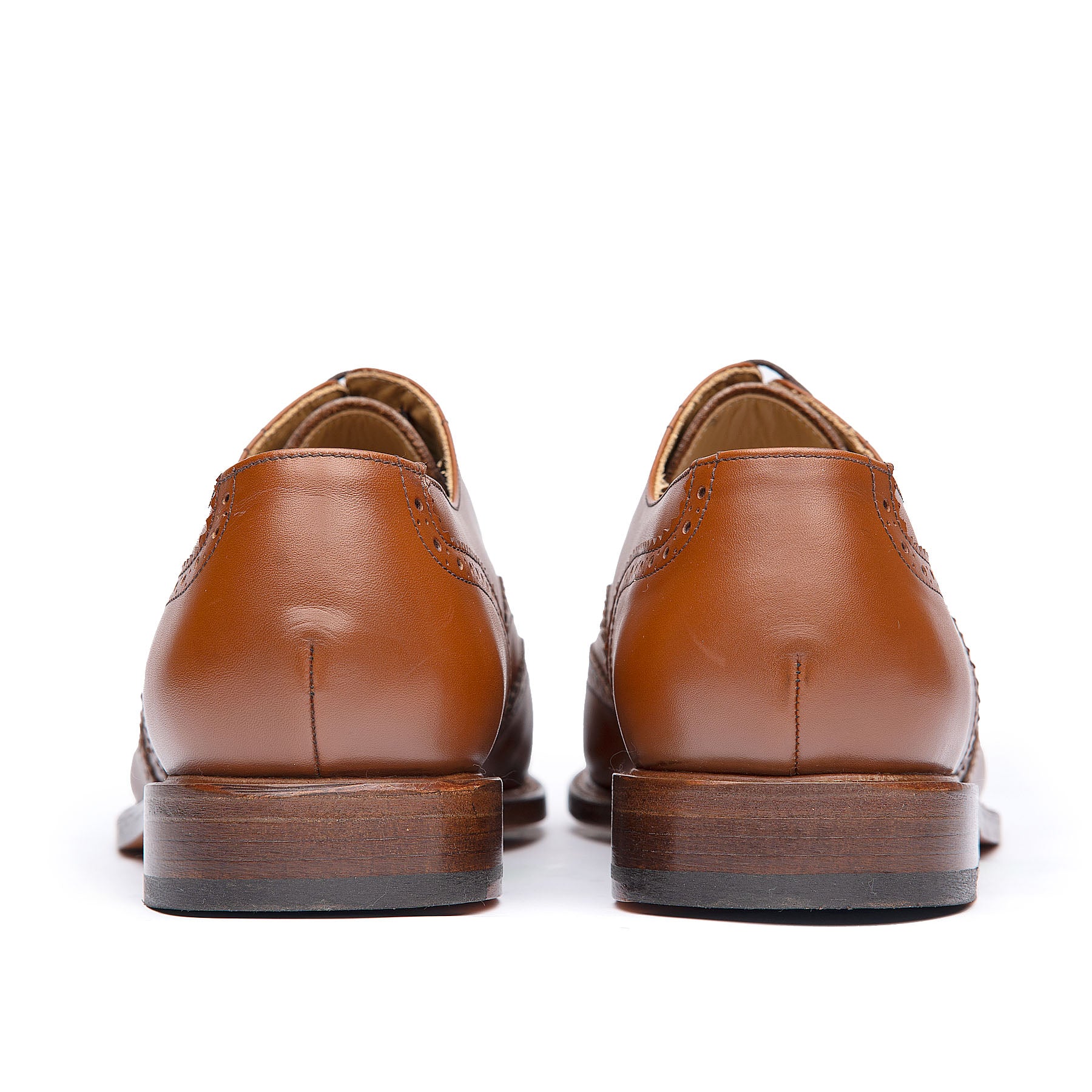 Mens tan wingtip dress shoes with stacked leather heel and rubber injection