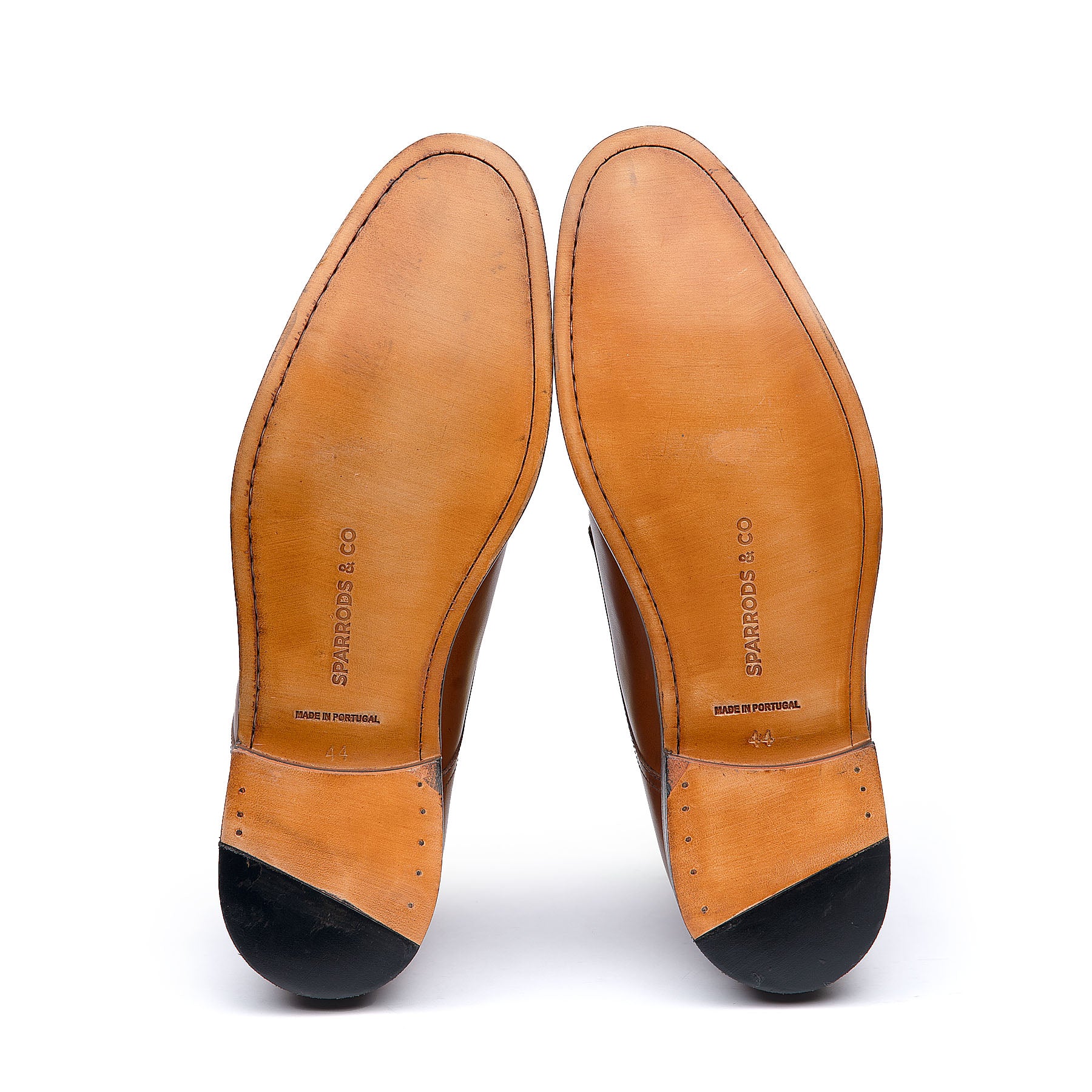 Tan brogue shoes with McKay stitched construction and leather sole.