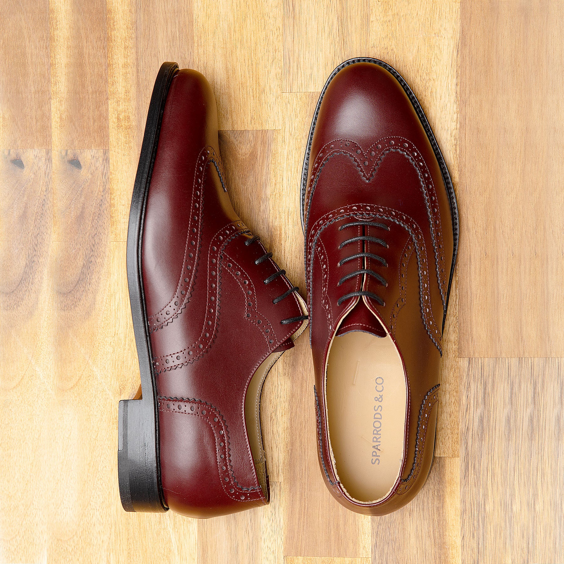 Burgundy brogue shoes with wingtip design for both casual and semi formal wear