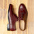 Burgundy brogue shoes with wingtip design for both casual and semi formal wear